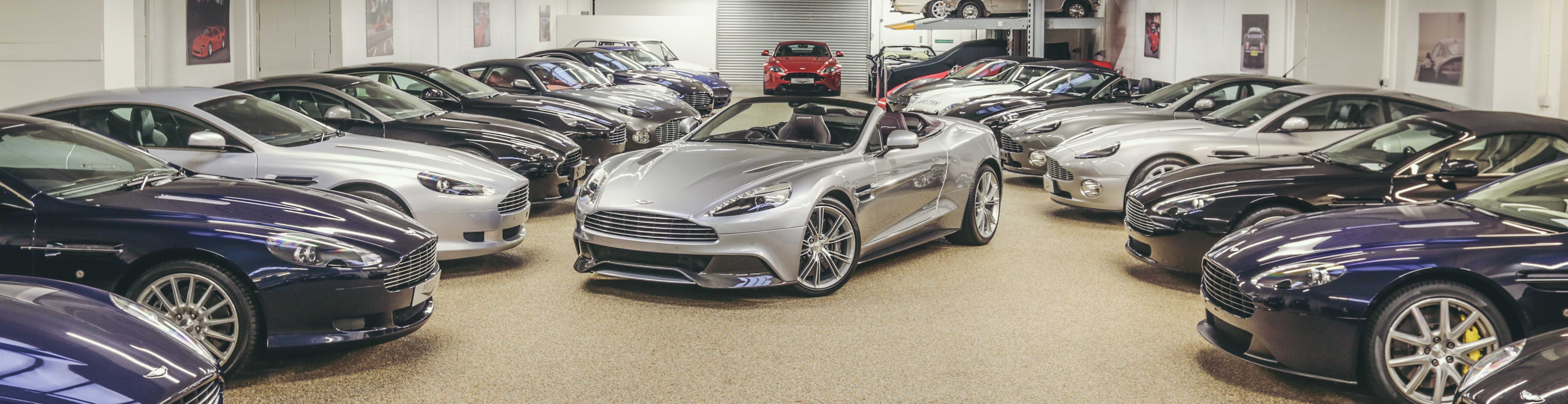 Images of Aston Martin cars in a Showroom