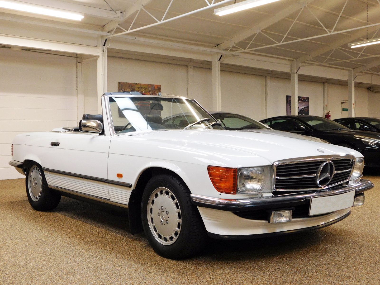 McGurk Performance Cars are pleased to offer this 300 SL. One Lady Owner From 1st August 1988 to 2016. Original Data Card And PDI Paperwork From 27-07-88. 18 Mercedes Benz Main Dealer Service Stamps Original Service Book. Last Serviced Mercedes Benz Stratford Upon Avon 2020. Every MOT From 3 Years Old to Date Documented As Follows: July 1991 16570 Miles. July 1992 20691 Miles. March 1993 21473 Miles. March 1994 24052 Miles. April 1995 25175 Miles. May 1996 26183 Miles. April 1997 27754 Miles. April 1998 28150 Miles. March 1999 28992 Miles. April 2000 29573 Miles. May 2001 30062 Miles. April 2002 30374 Miles. March 2003 30739 Miles. July 2004 31614 Miles. August 2005 32099 Miles. July 2006 32494 Miles. July 2007 32729 Miles. July 2008 32891 Miles. July 2009 33040 Miles. July 2010 33104 Miles. July 2011 33248 Miles. July 2012 33361 Miles. July 2013 33488 Miles. July 2014 33523 Miles. August 2015 33558 Miles. August 2016 34343 Miles. August 2017 34502 Miles August 2018 34560 Miles Only 2 Mot Advisories To Date As Follows: Slightly Blocked Washer Jets. Slight Exhaust Blow, Renewed By Mercedes Benz. Original Tool Kit And Hand Books Including Leather Wallet. X4 Michelin Factory Tyres. Full Black leather Interior. Rear Seating. Original Fire Extinguisher. Spare Wheel & Tyre Unused. Original Number Plates From 1988 Macclesfield Mercedes Benz. Electric Windows. Front Fog Lights. Original Black Mohair Soft Top. White Factory Fitted Hard Top. Immaculate Unmarked Condition Throughout. Very Rare To Source In This Immaculate Unrestored Condition. Original Factory Paintwork And Wax Oil. A Perfect Example For Increasing Investment Potential Or Show Vehicle.