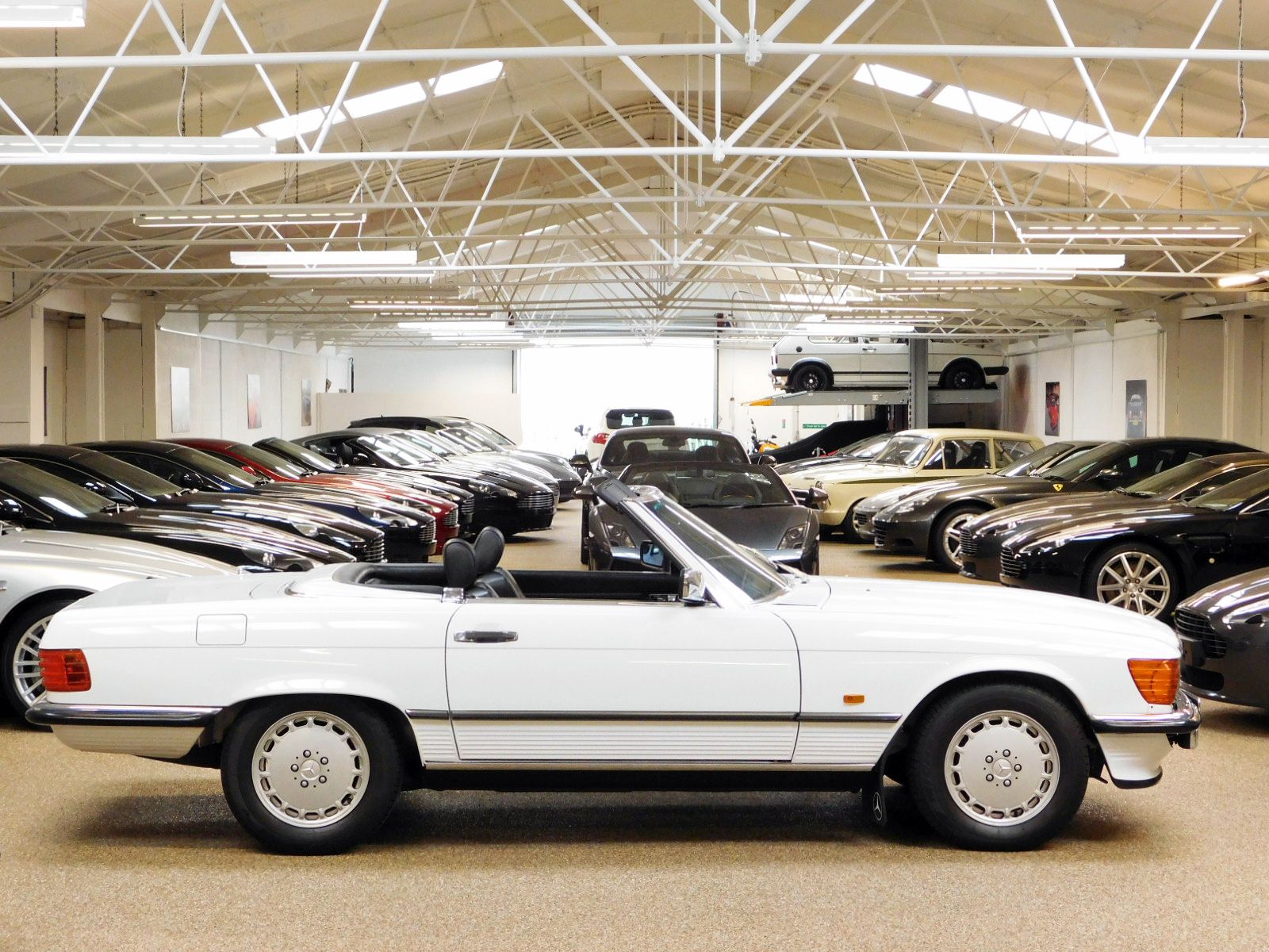 McGurk Performance Cars are pleased to offer this 300 SL. One Lady Owner From 1st August 1988 to 2016. Original Data Card And PDI Paperwork From 27-07-88. 18 Mercedes Benz Main Dealer Service Stamps Original Service Book. Last Serviced Mercedes Benz Stratford Upon Avon 2020. Every MOT From 3 Years Old to Date Documented As Follows: July 1991 16570 Miles. July 1992 20691 Miles. March 1993 21473 Miles. March 1994 24052 Miles. April 1995 25175 Miles. May 1996 26183 Miles. April 1997 27754 Miles. April 1998 28150 Miles. March 1999 28992 Miles. April 2000 29573 Miles. May 2001 30062 Miles. April 2002 30374 Miles. March 2003 30739 Miles. July 2004 31614 Miles. August 2005 32099 Miles. July 2006 32494 Miles. July 2007 32729 Miles. July 2008 32891 Miles. July 2009 33040 Miles. July 2010 33104 Miles. July 2011 33248 Miles. July 2012 33361 Miles. July 2013 33488 Miles. July 2014 33523 Miles. August 2015 33558 Miles. August 2016 34343 Miles. August 2017 34502 Miles August 2018 34560 Miles Only 2 Mot Advisories To Date As Follows: Slightly Blocked Washer Jets. Slight Exhaust Blow, Renewed By Mercedes Benz. Original Tool Kit And Hand Books Including Leather Wallet. X4 Michelin Factory Tyres. Full Black leather Interior. Rear Seating. Original Fire Extinguisher. Spare Wheel & Tyre Unused. Original Number Plates From 1988 Macclesfield Mercedes Benz. Electric Windows. Front Fog Lights. Original Black Mohair Soft Top. White Factory Fitted Hard Top. Immaculate Unmarked Condition Throughout. Very Rare To Source In This Immaculate Unrestored Condition. Original Factory Paintwork And Wax Oil. A Perfect Example For Increasing Investment Potential Or Show Vehicle.